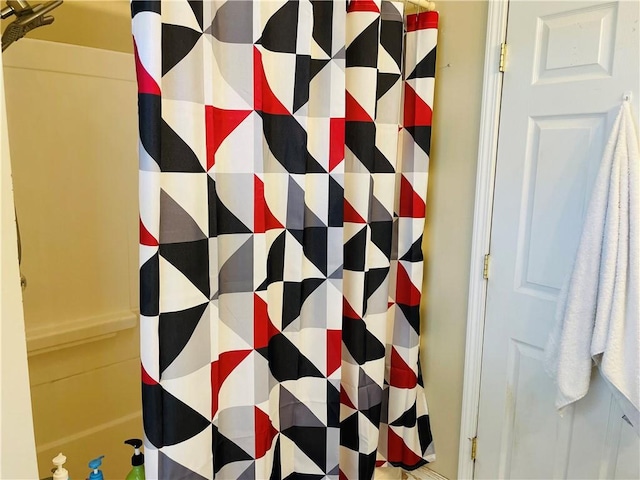 full bath with a shower with shower curtain