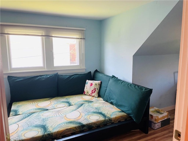bedroom with wood finished floors