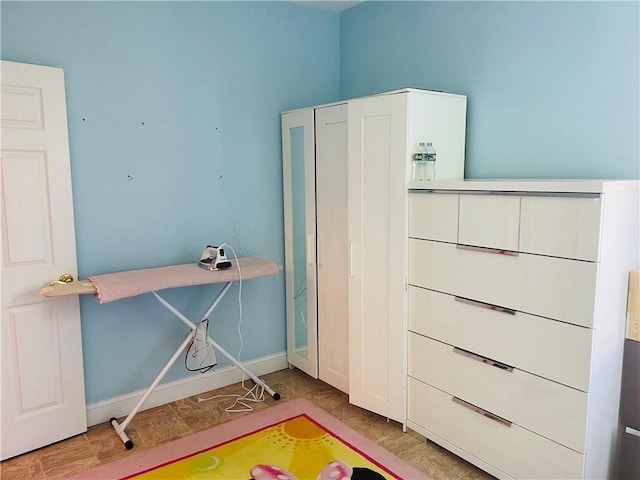 interior space featuring baseboards