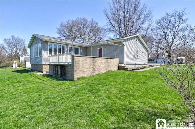 back of house with a yard