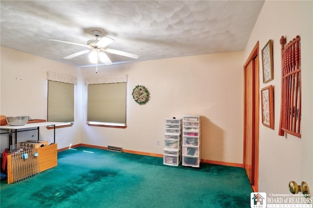 miscellaneous room featuring carpet flooring, baseboards, and ceiling fan