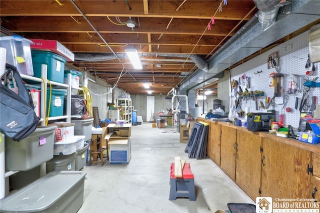 unfinished basement with a workshop area