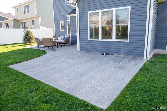 view of patio / terrace with an outdoor hangout area and fence