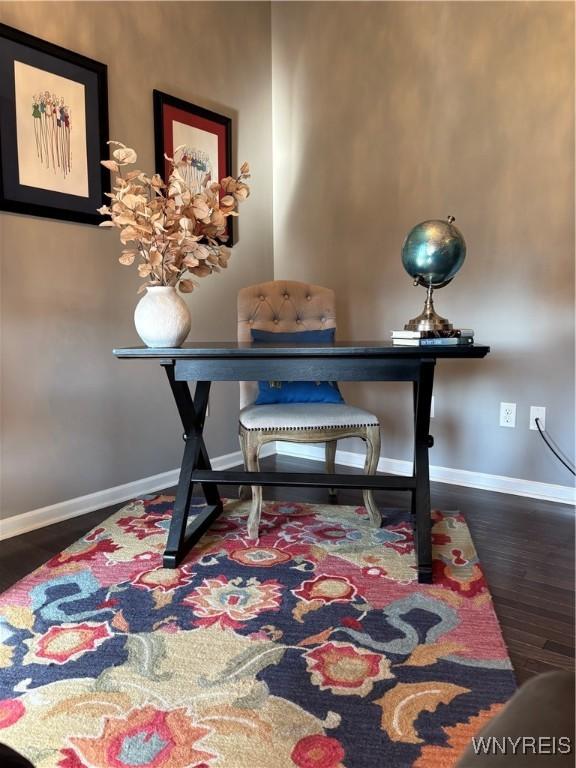office area featuring baseboards and wood finished floors