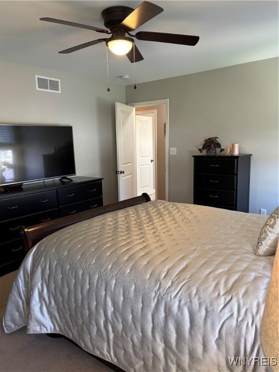 bedroom with a ceiling fan and visible vents