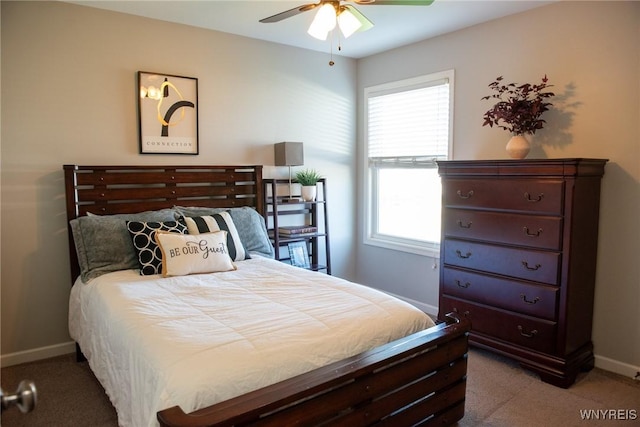 bedroom featuring baseboards, carpet flooring, and ceiling fan