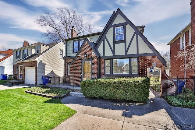 35 University Ct, Amherst, NY 14226 - tudor house with an attached garage, brick siding, a front yard, and stucco siding