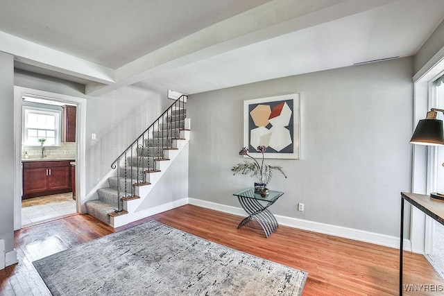 35 University Ct, Amherst, NY 14226 - stairway featuring baseboards and wood finished floors