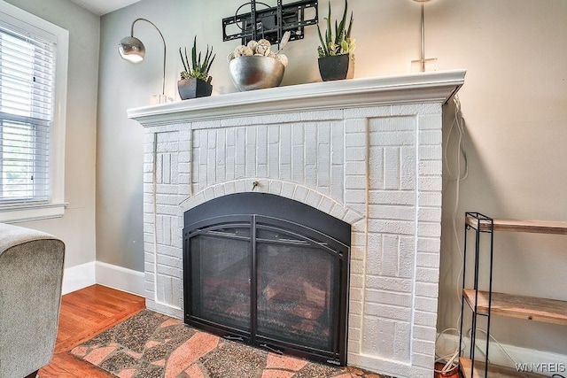 35 University Ct, Amherst, NY 14226 - interior details with wood finished floors, baseboards, and a fireplace