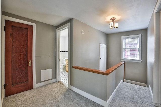 35 University Ct, Amherst, NY 14226 - entryway featuring carpet floors, baseboards, and a notable chandelier
