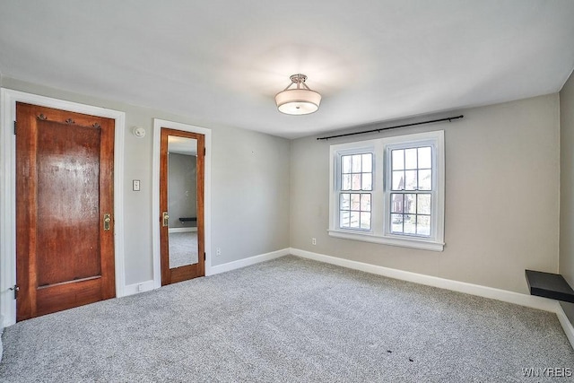 35 University Ct, Amherst, NY 14226 - spare room featuring baseboards and carpet floors