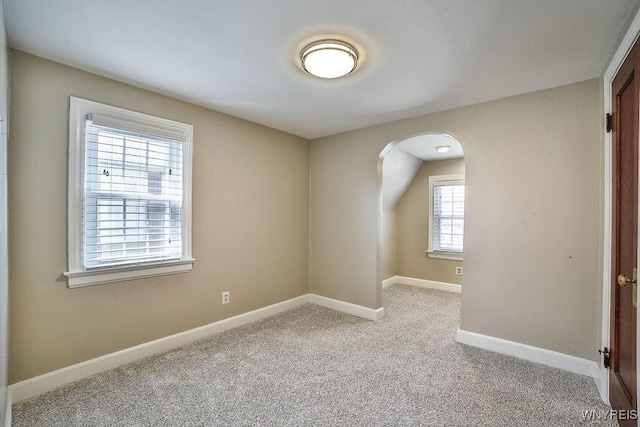 35 University Ct, Amherst, NY 14226 - unfurnished room featuring arched walkways, carpet floors, and baseboards