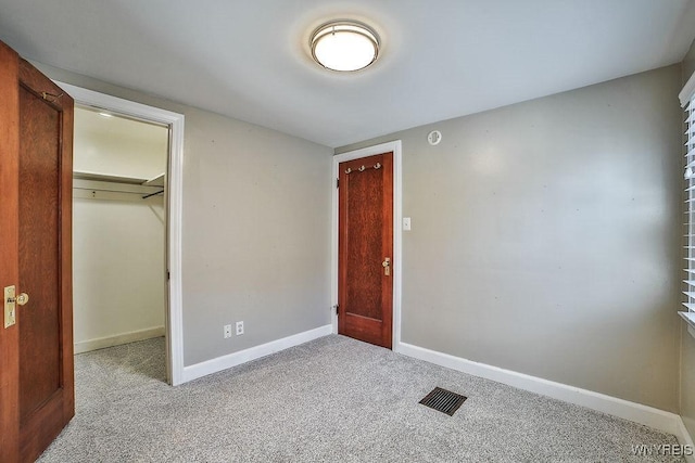 35 University Ct, Amherst, NY 14226 - unfurnished bedroom featuring a closet, visible vents, carpet flooring, and baseboards