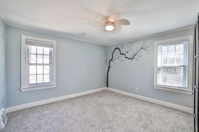 35 University Ct, Amherst, NY 14226 - carpeted empty room with baseboards, ornamental molding, and a healthy amount of sunlight