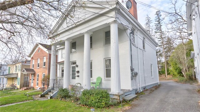 view of property exterior with a chimney