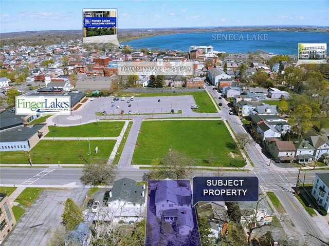 bird's eye view with a residential view and a water view
