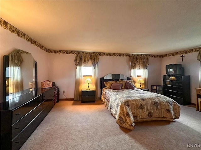 bedroom with light colored carpet