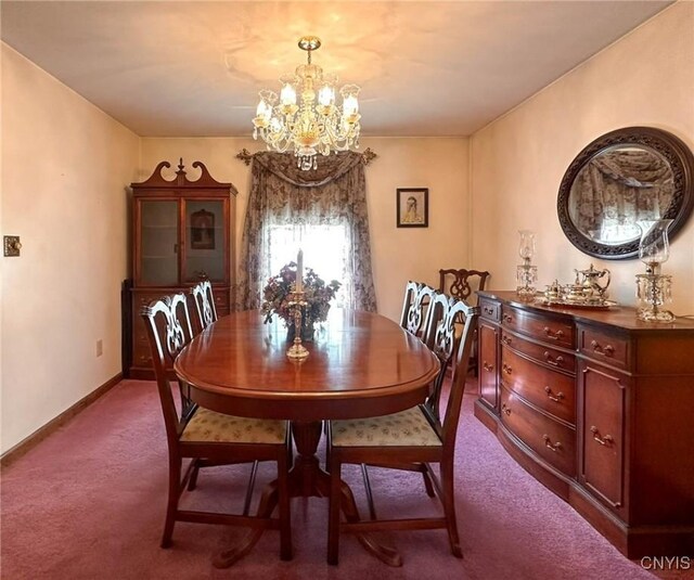 dining room featuring baseboards, carpet flooring, and a chandelier