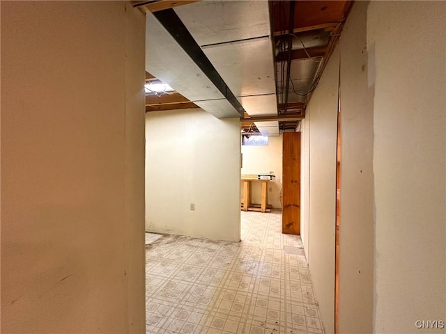 finished below grade area featuring tile patterned floors