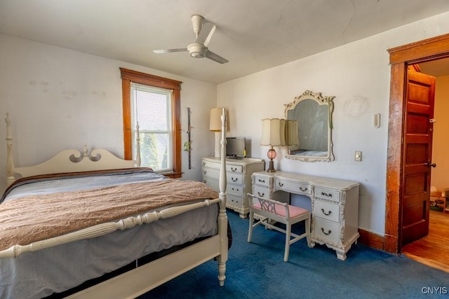 bedroom with ceiling fan and carpet