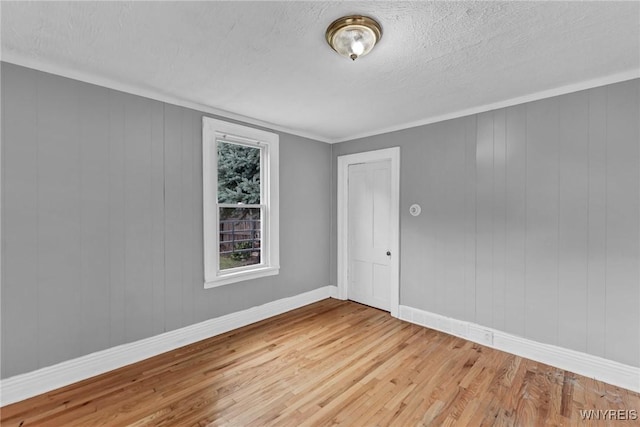 348 Virginia St, Buffalo, NY 14201 - unfurnished room with baseboards, wood finished floors, and a textured ceiling