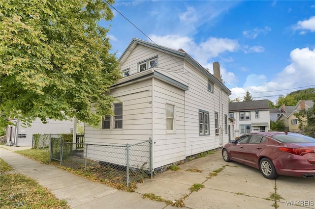 348 Virginia St, Buffalo, NY 14201 - view of property exterior featuring a chimney and fence