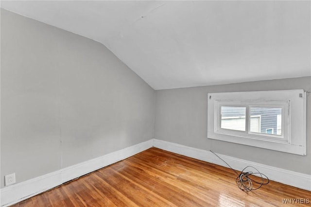 348 Virginia St, Buffalo, NY 14201 - empty room with lofted ceiling, baseboards, and wood finished floors