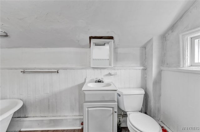348 Virginia St, Buffalo, NY 14201 - bathroom featuring a soaking tub, toilet, vanity, and wooden walls