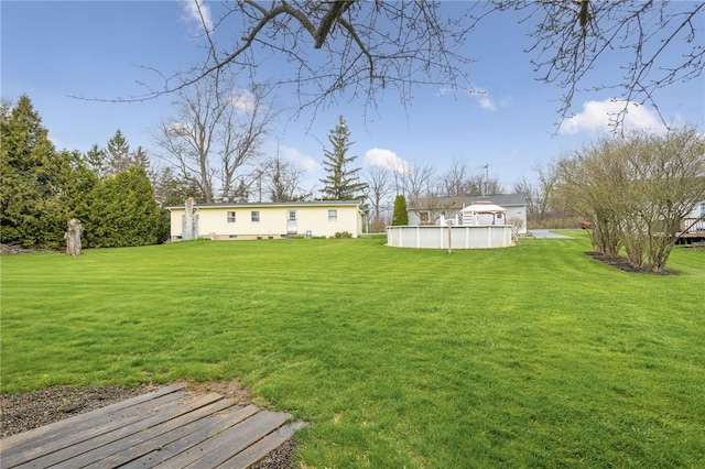 view of yard with an outdoor pool