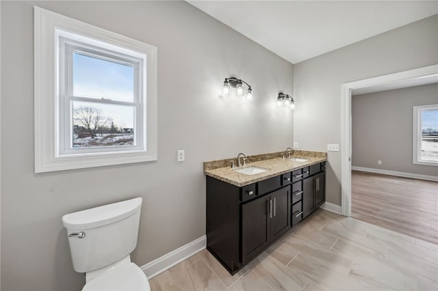 2 Stella Ln, Ogden, NY 14559 - bathroom featuring baseboards and double vanity