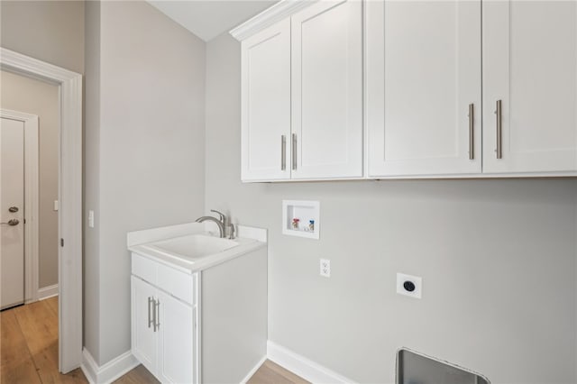 2 Stella Ln, Ogden, NY 14559 - washroom featuring hookup for an electric dryer, hookup for a washing machine, cabinet space, and light wood-style floors