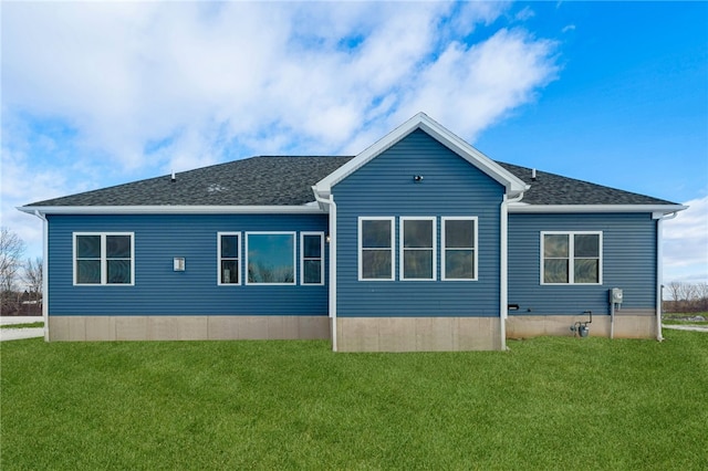 2 Stella Ln, Ogden, NY 14559 - back of house featuring a yard and roof with shingles