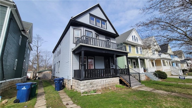 36 Fairfield Ave, Buffalo, NY 14214 - view of front of home featuring a front yard, a balcony, and covered porch