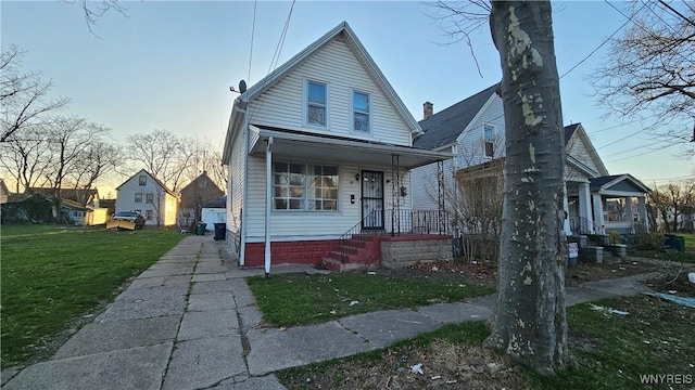 86 Roehrer Ave, Buffalo, NY 14208 - bungalow-style home featuring covered porch and a front yard