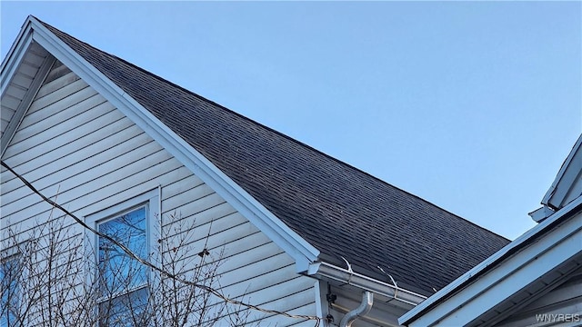 86 Roehrer Ave, Buffalo, NY 14208 - details featuring gutters, roof with shingles, and a downspout
