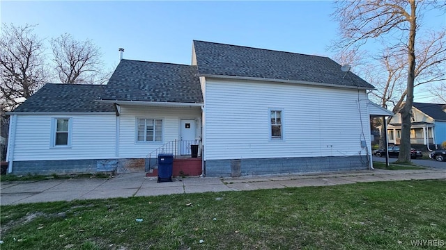 86 Roehrer Ave, Buffalo, NY 14208 - back of property with a lawn and roof with shingles
