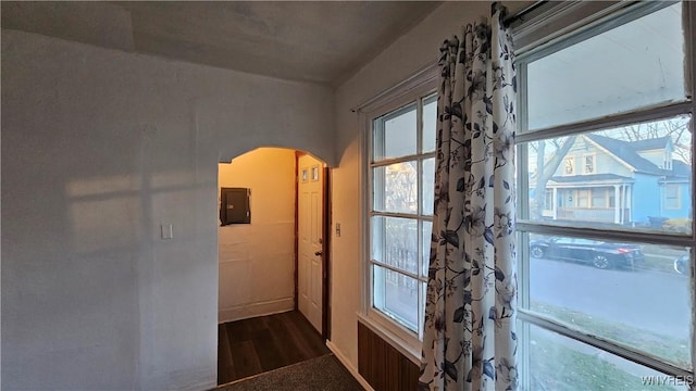 86 Roehrer Ave, Buffalo, NY 14208 - hall with plenty of natural light, baseboards, arched walkways, and dark wood-type flooring