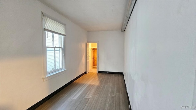 86 Roehrer Ave, Buffalo, NY 14208 - empty room featuring wood finished floors, baseboards, and plenty of natural light