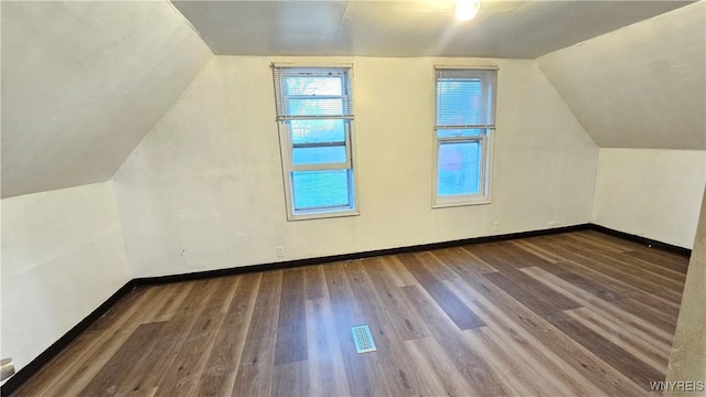 86 Roehrer Ave, Buffalo, NY 14208 - additional living space featuring vaulted ceiling, wood finished floors, visible vents, and baseboards