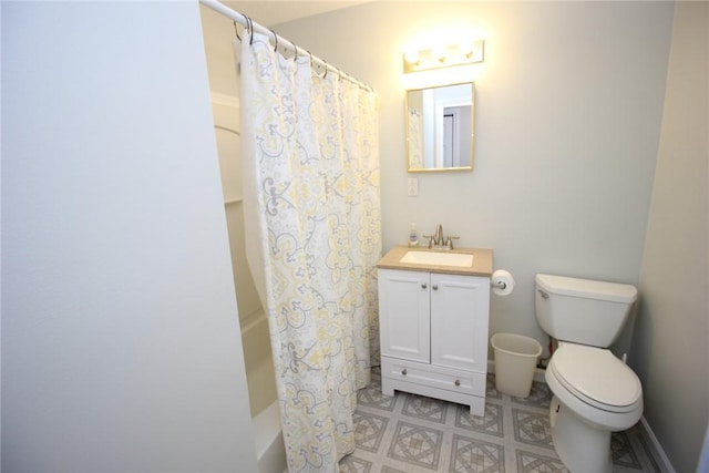 bathroom featuring toilet and vanity