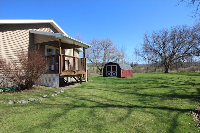 view of yard featuring a storage shed, an outbuilding, stairway, and a deck