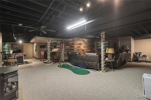 finished below grade area featuring indoor bar and carpet flooring