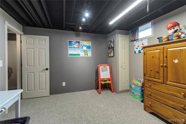 game room featuring light colored carpet