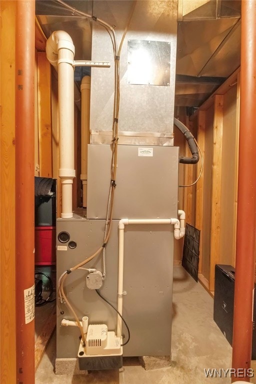 utility room featuring heating unit