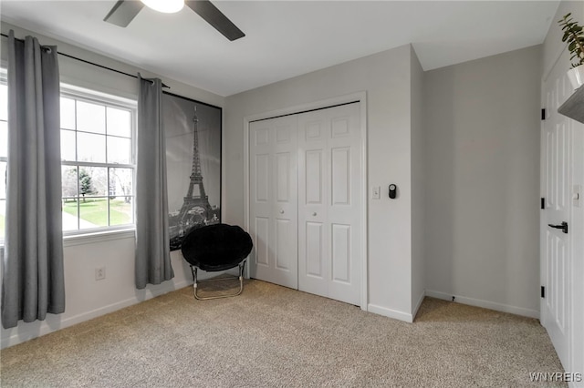 bedroom featuring a ceiling fan, baseboards, carpet floors, and a closet
