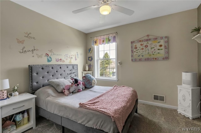 carpeted bedroom with baseboards, a ceiling fan, and visible vents
