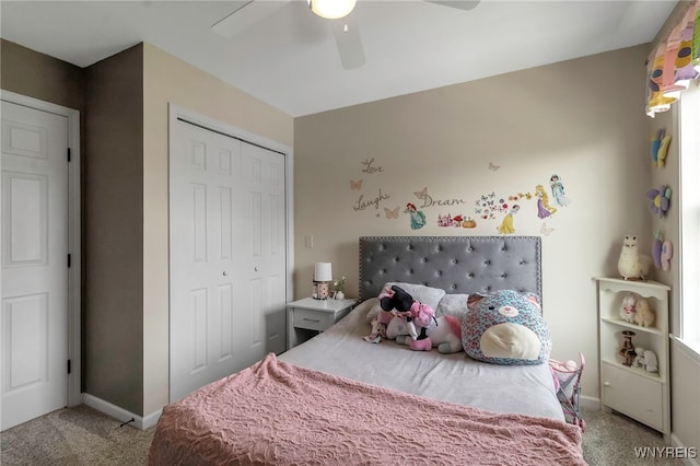 bedroom featuring baseboards, carpet floors, ceiling fan, and a closet