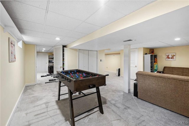 game room with a drop ceiling, baseboards, visible vents, recessed lighting, and light colored carpet