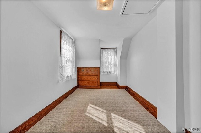 additional living space featuring baseboards