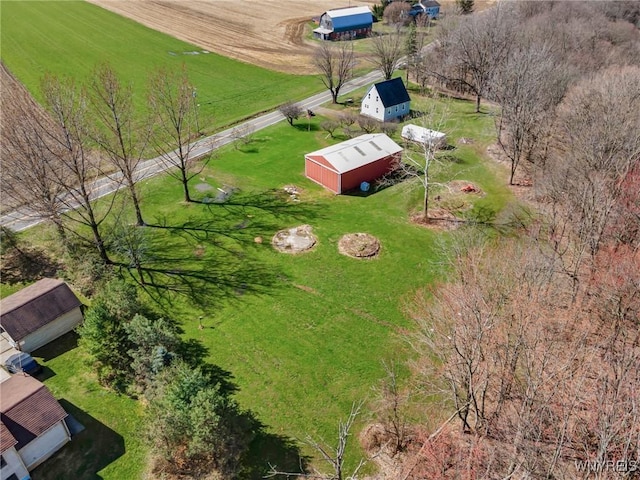 birds eye view of property with a rural view